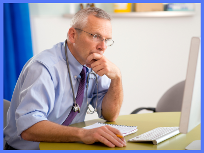 Doctor looking at computer