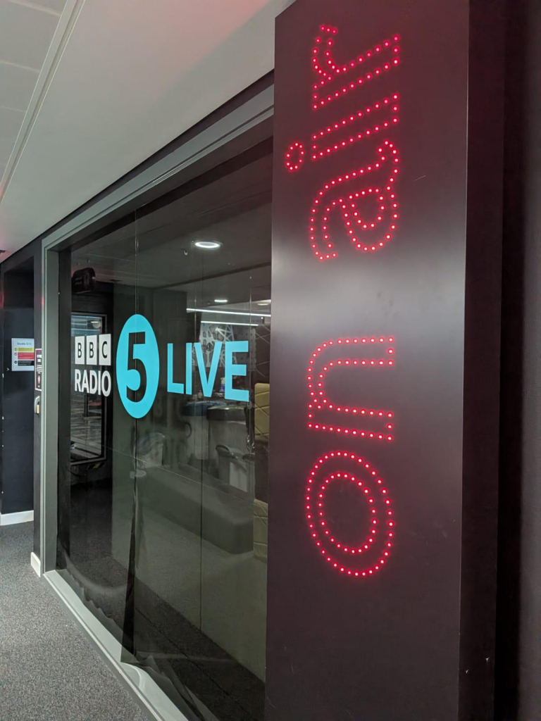 Outside the BBC 5Live studio, the wall lights up in red to say On Air